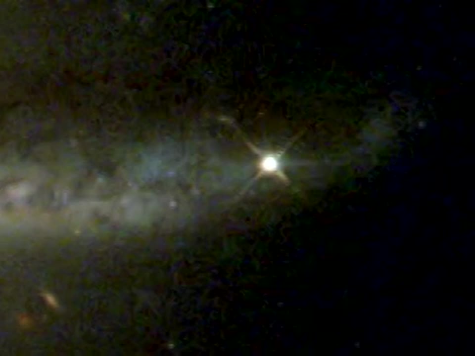 Hubble Photographs Warped Galaxy as Camera Passes Milestone