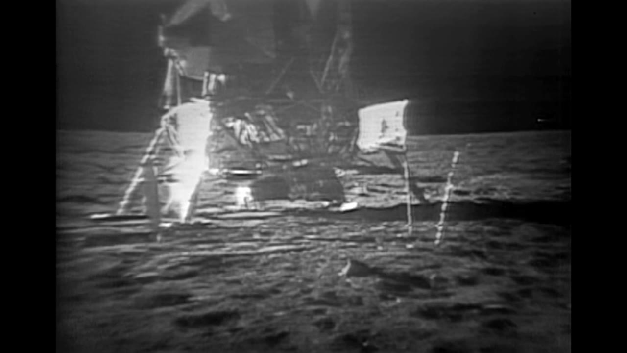 Partially Restored Video: Buzz Aldrin Carrying Experiment Packages